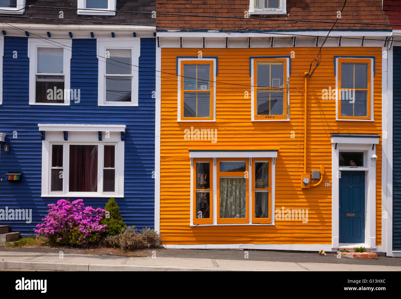 Colourful row houses (Jellybean Row) in downtown St. John's, Avalon Peninsula, Newfoundland, Canada. Stock Photo