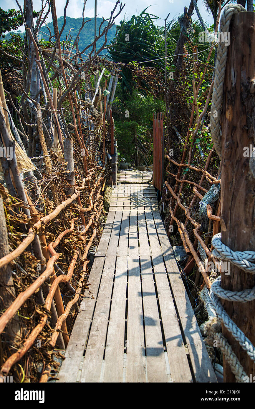Wooden pathway in the forest in Thailand Stock Photo