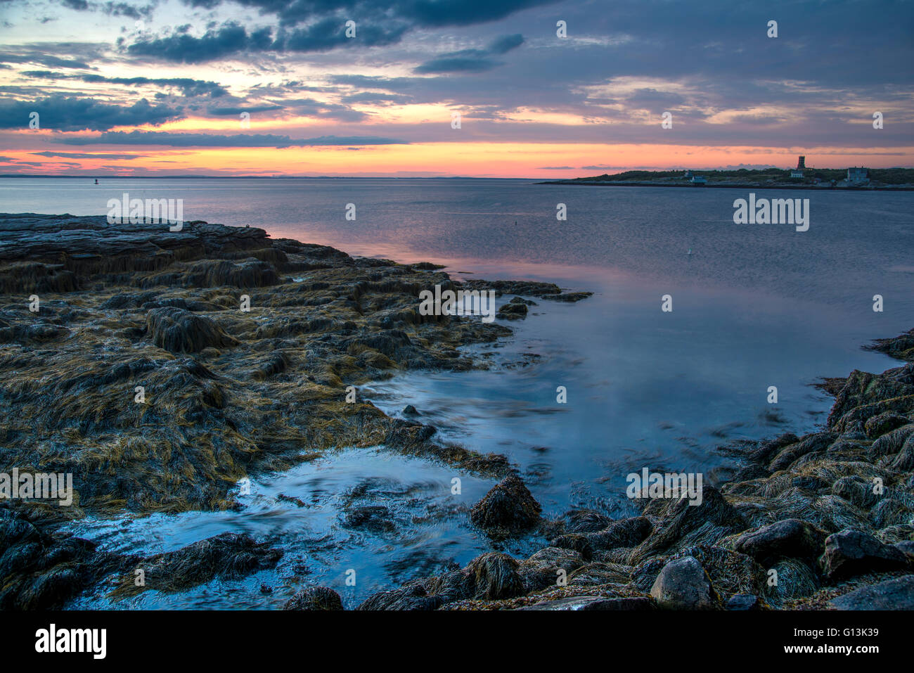 Image of the sunset from Star Island, New Hampshire, USA with a view of Isle of Shoals/ Cedar Island Stock Photo