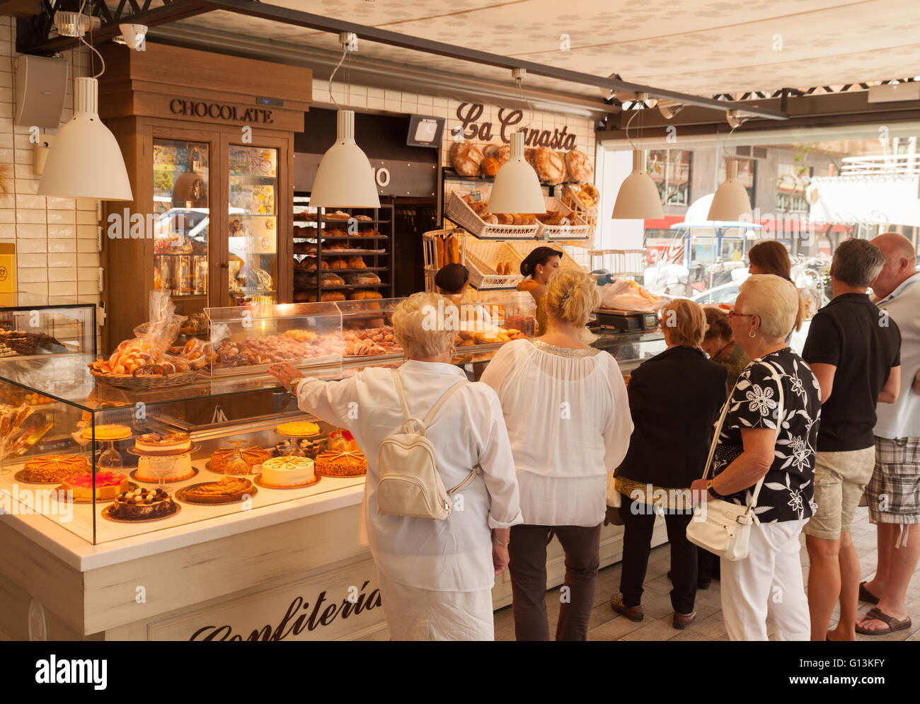 Customers buying bread and pastries in a bakery, Marbella, Andalusia, Spain, Europe Stock Photo