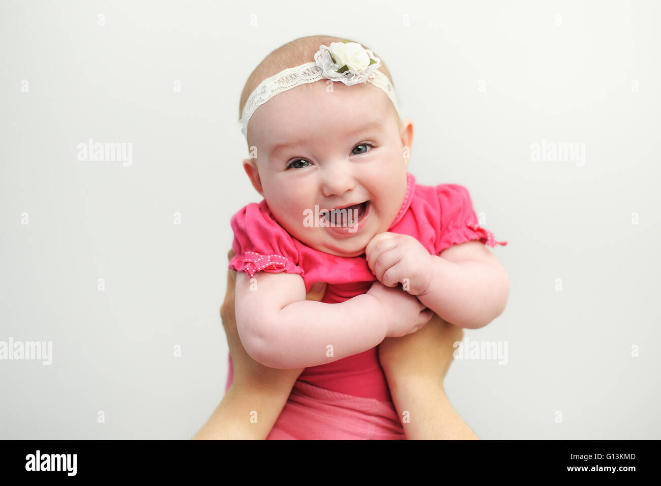 Mom keeps a baby daughter in her arms Stock Photo
