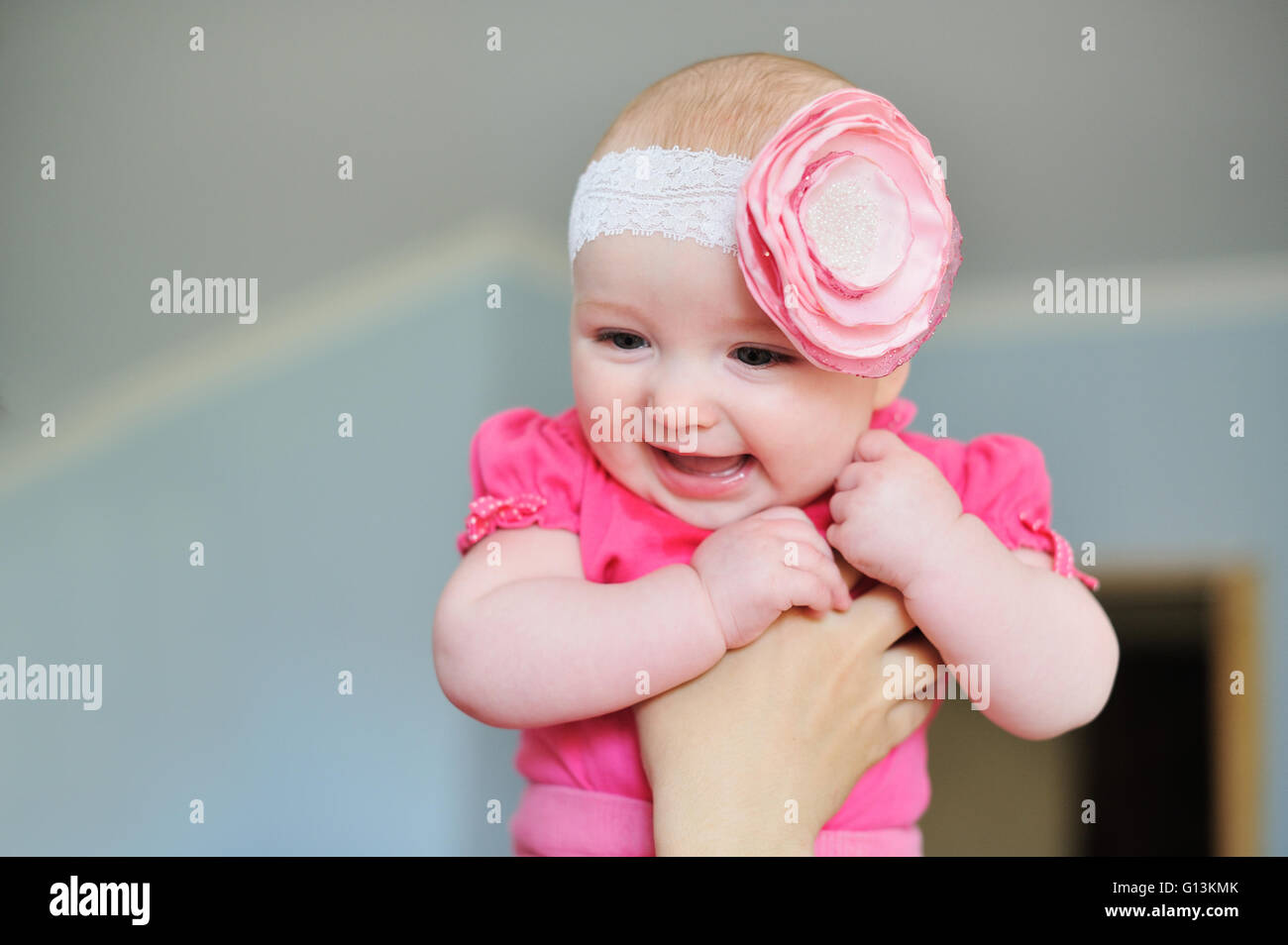 Mom keeps a baby daughter in her arms Stock Photo