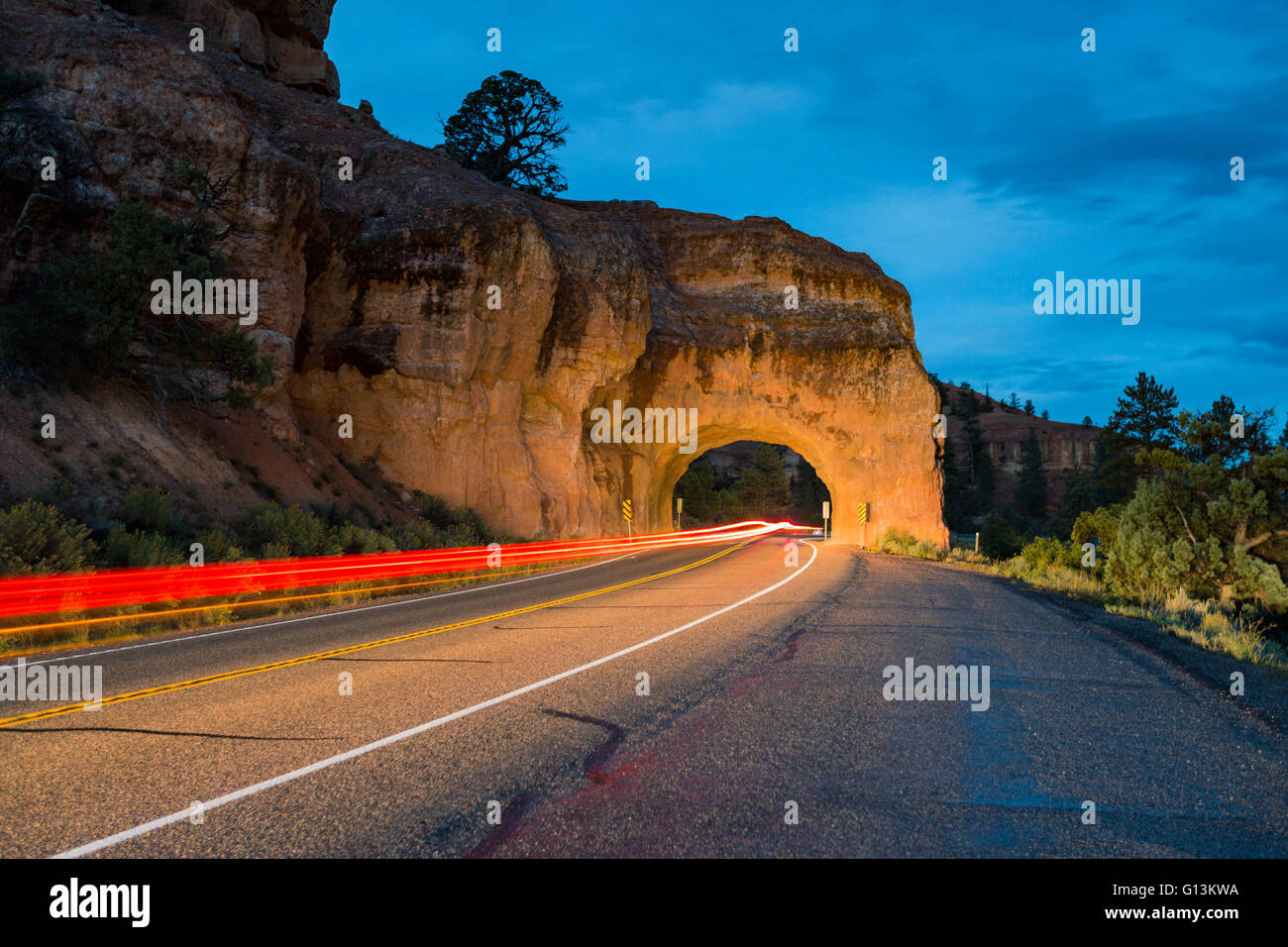 Lights of cars passing through Red Canyon Tunnel on scenic byway 12 Stock Photo