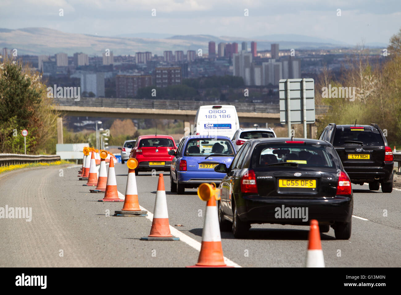 Traffic on M77 Motorway with view of Glasgow Stock Photo