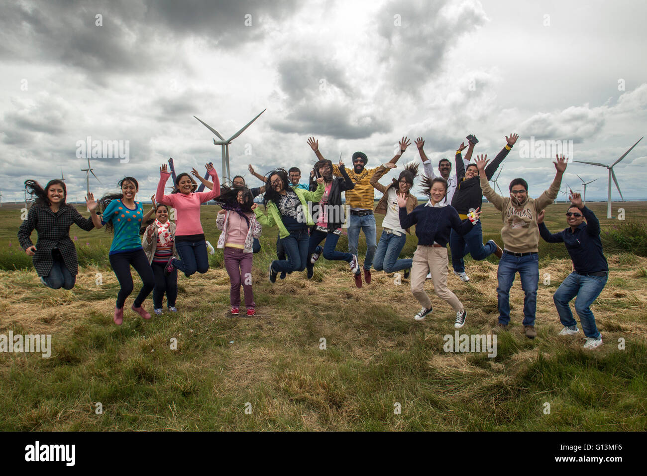 ethnic diversity at wind farm Stock Photo