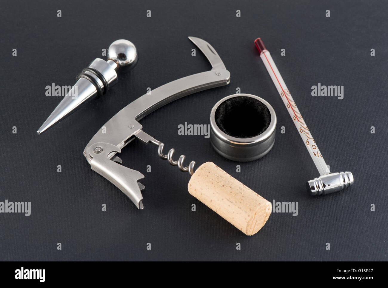 Corkscrew and accessories for wine on black background Stock Photo