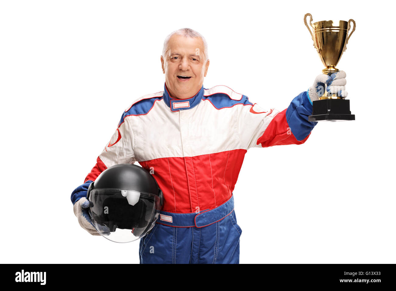 Studio shot of a senior car racing champion holding a trophy isolated on white background Stock Photo