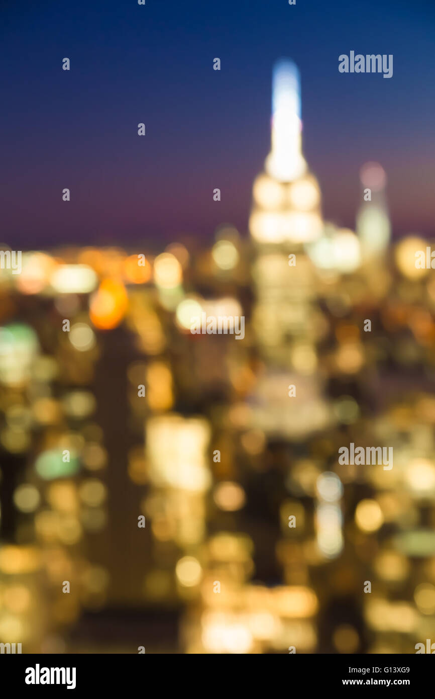 Defocused view of New York City Manhattan skyline lit up at night Stock ...