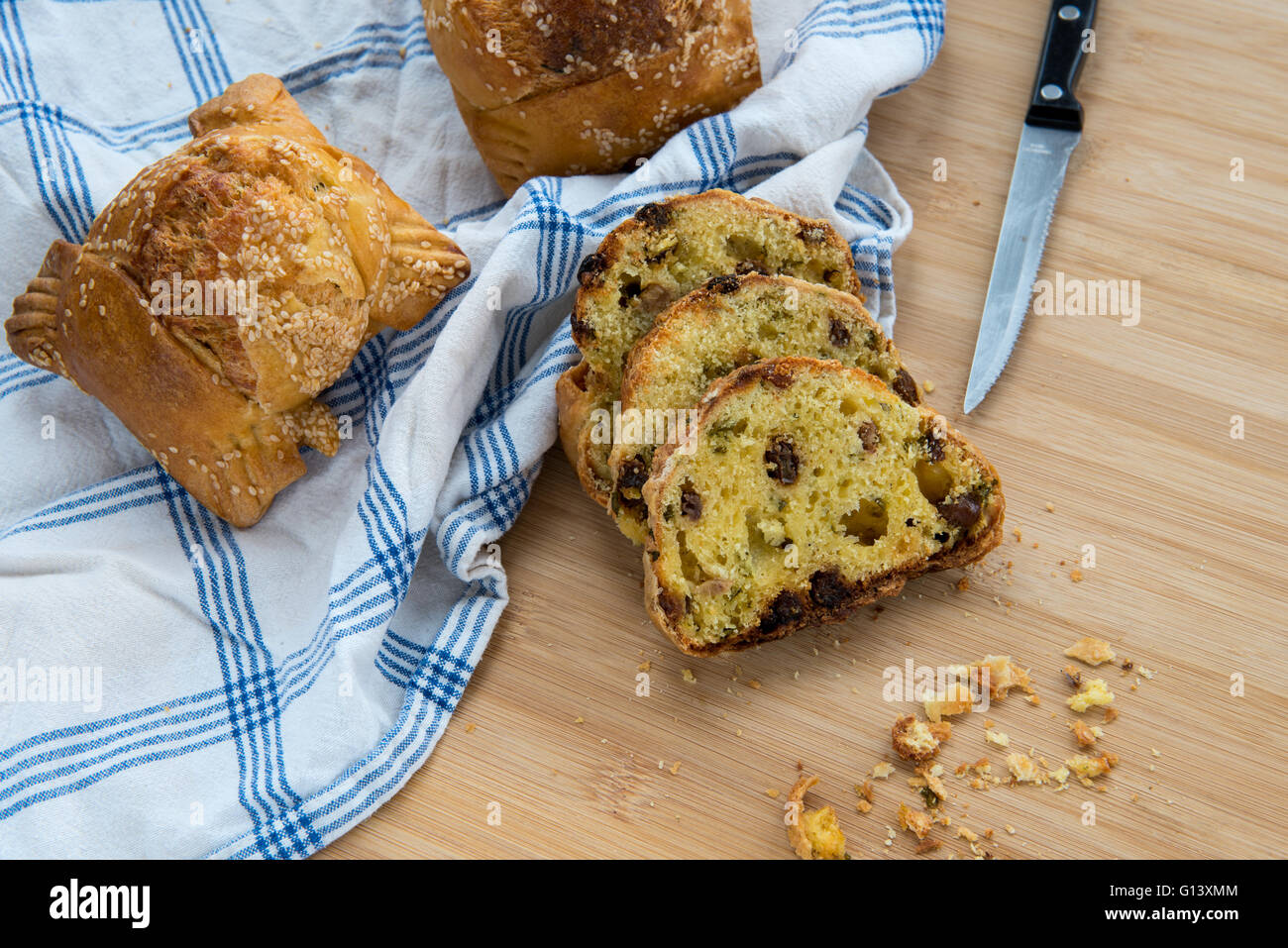 Traditional Cypriot easter cheese pastries, flaounes and knife Stock