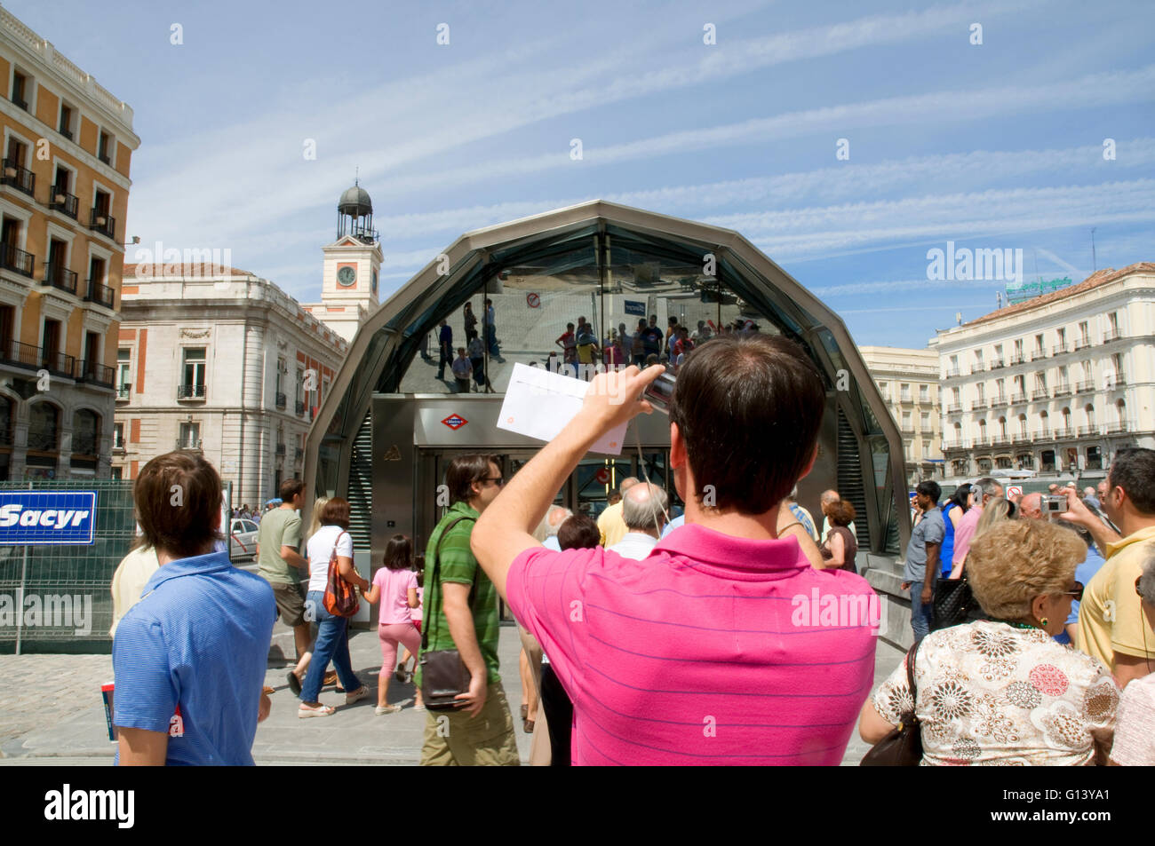 Man taking photos of the new station. Puerta del Sol, Madrid, Spain. Stock Photo