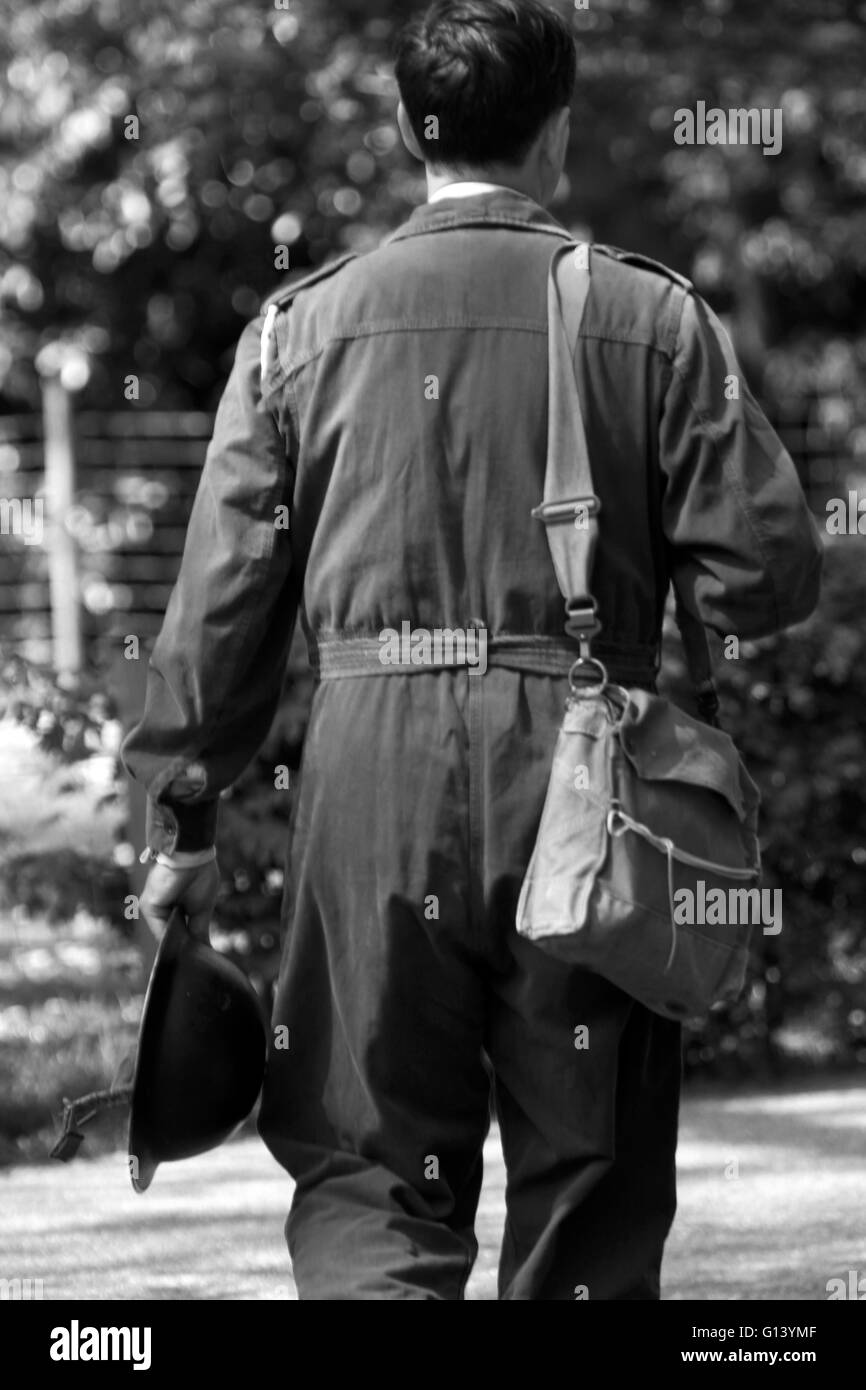 man in WW2 ARP uniform with tin hat and Gas mask Bag (credit image©Jack Ludlam) Stock Photo