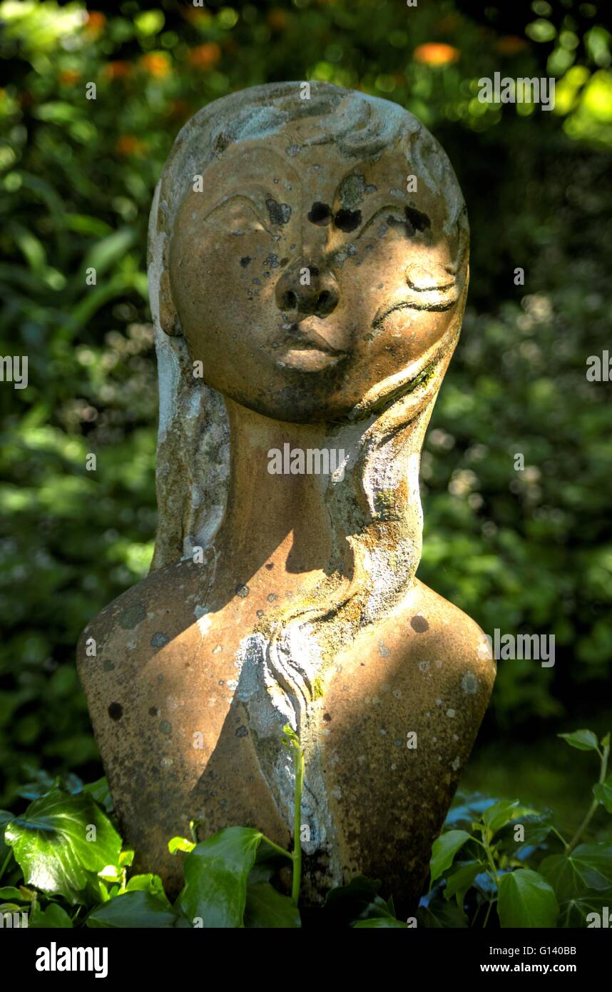 A statue from Colby Woodland Garden Stock Photo