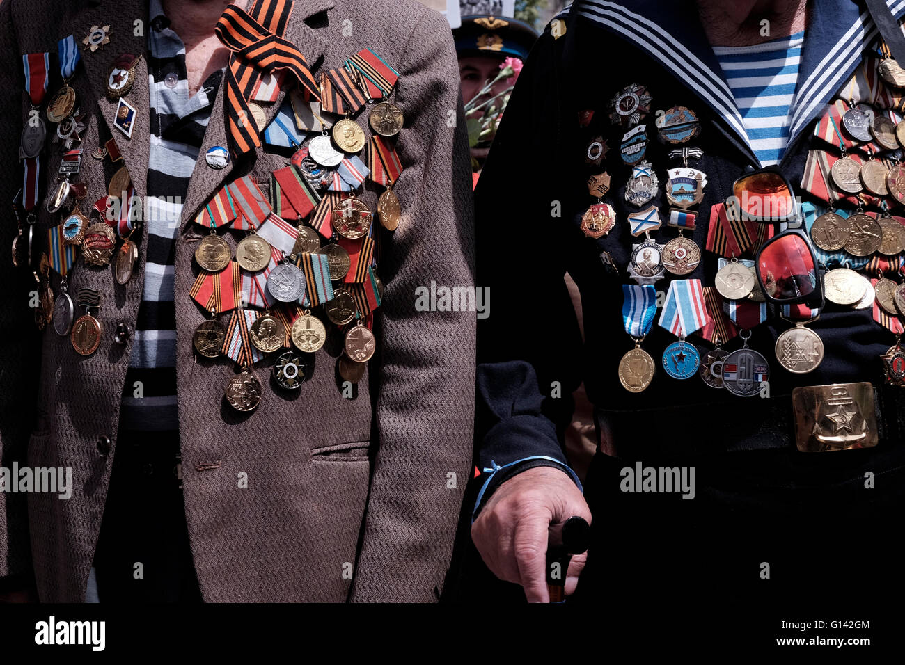 Soviet Jewish World War II veterans with medals pinned in their old uniforms during ceremony marking the Allied Victory over Nazi Germany in Israel Stock Photo