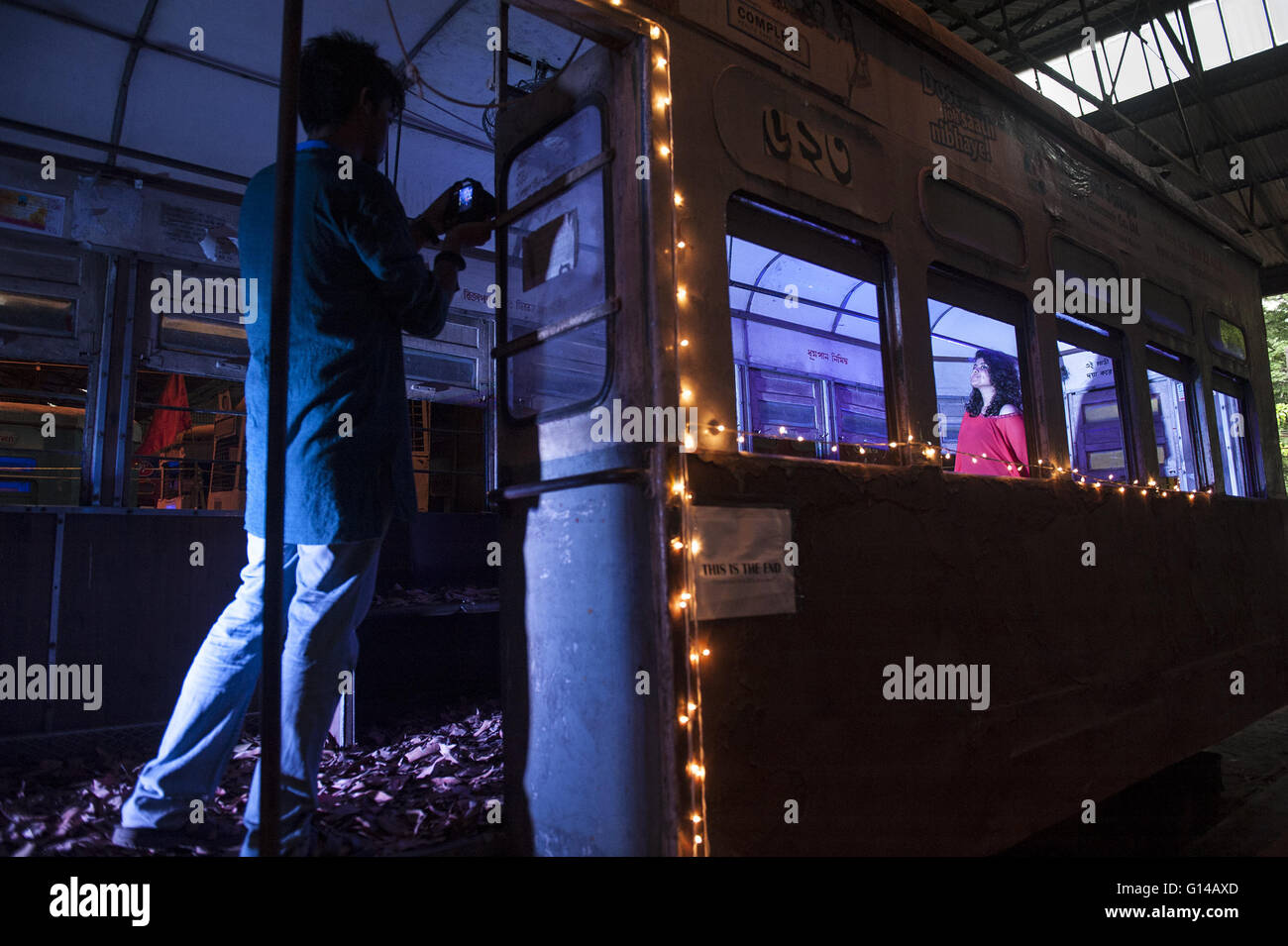 Kolkata, Indian state West Bengal. 8th May, 2016. A girl poses inside a tramcar during the two-day event Tram Tales at a tram depot in Kolkata, capital of eastern Indian state West Bengal, May 8, 2016. Tram Tales was planned as a unique mixed - media interactive visual installation piece using videos, music, photography, games, food and interaction to celebrate the nostalgia of trams as a symbol of Kolkata's rich colonial-era heritage. The event was held from May 7 to 8. © Tumpa Mondal/Xinhua/Alamy Live News Stock Photo