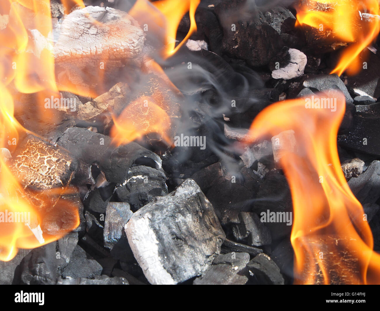 burning charcoal with flames on a barbecue Stock Photo Alamy