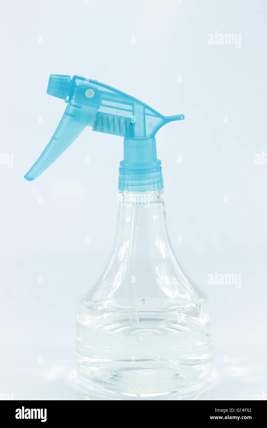 Blue plastic spray water white background Stock Photo - Alamy