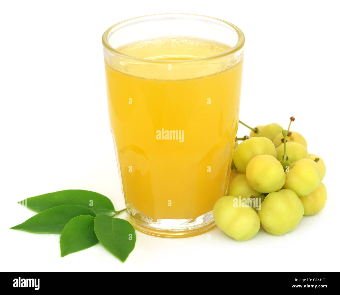 Phyllanthus acidus or Star gooseberry with juice in a glass Stock Photo