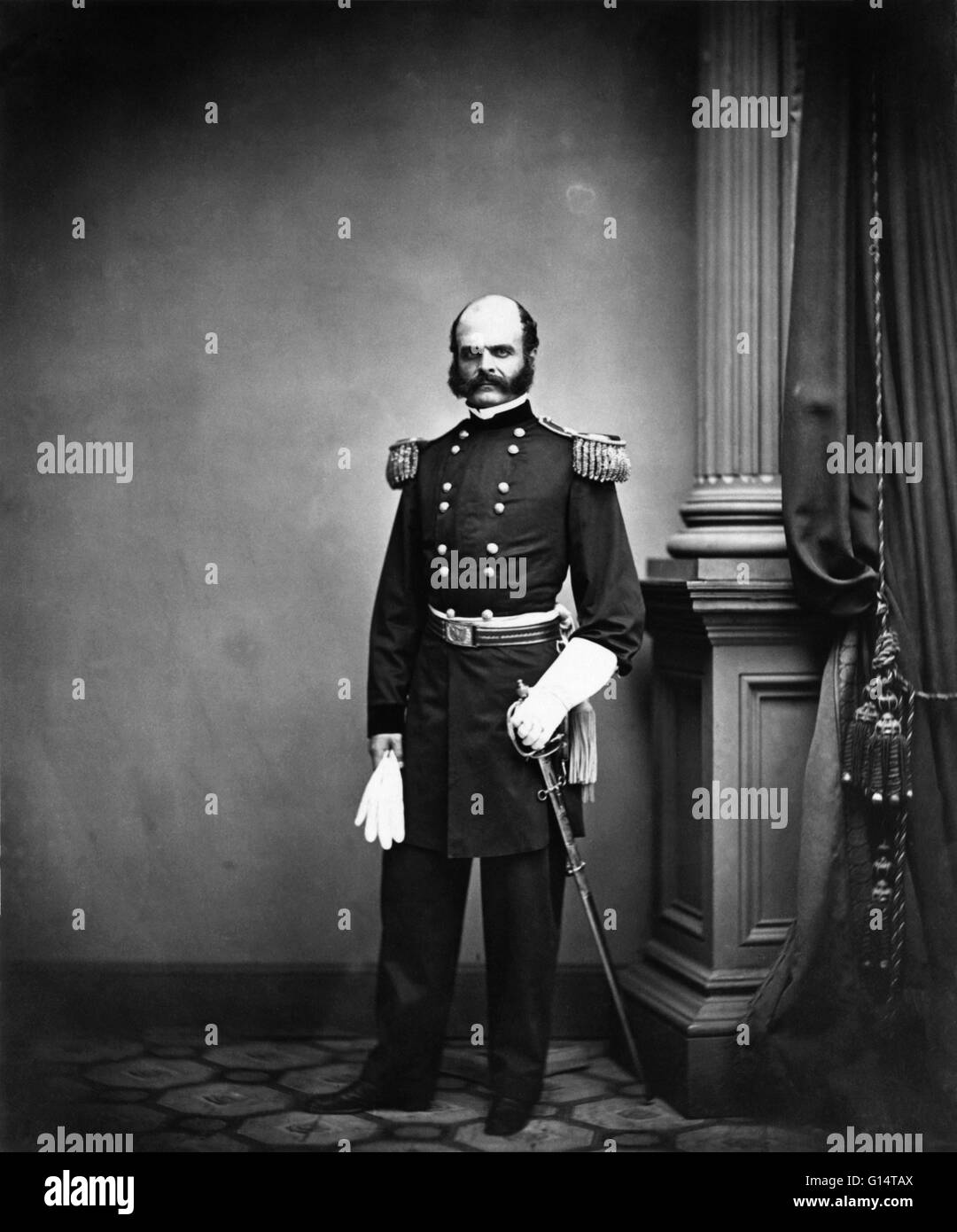 Entitled: General Ambrose E. Burnside of 1st Rhode Island Infantry Regiment and General Staff U.S. Volunteers Infantry Regiment with gauntlets and sword. Photographed by Mathew Brady. Ambrose Everett Burnside (May 23, 1824 - September 13, 1881) was an Ame Stock Photo