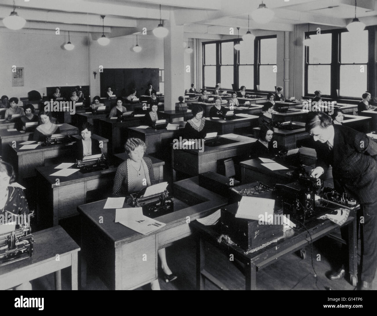 Secretarial school, United States, circa 1920's. Young women learn