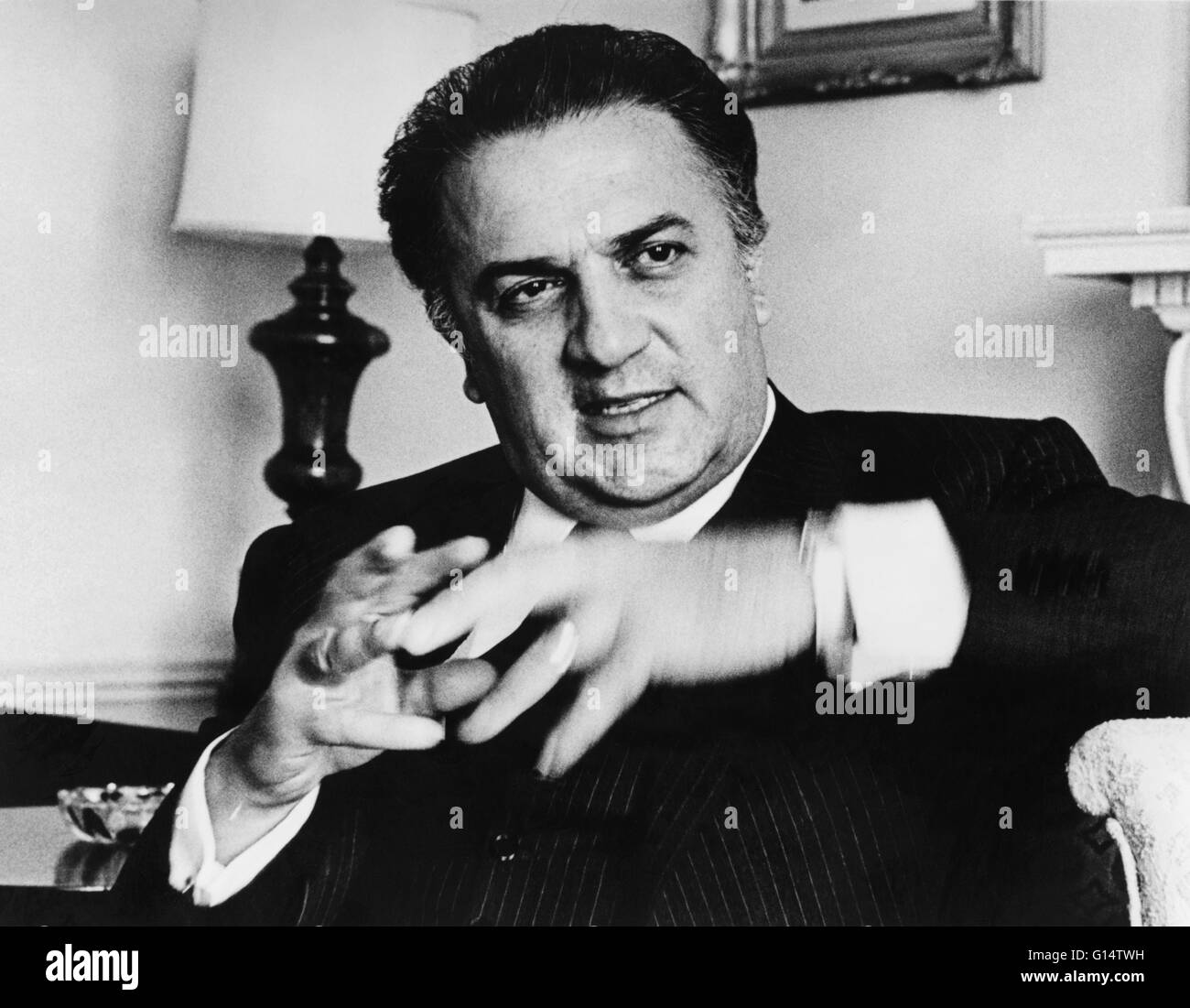 Fellini, photographed in 1965 by Walter Albertin. Federico Fellini (January 20, 1920 - October 31, 1993) was an Italian film director and scriptwriter. Known for a distinct style that blends fantasy and baroque images, he is considered one of the most inf Stock Photo