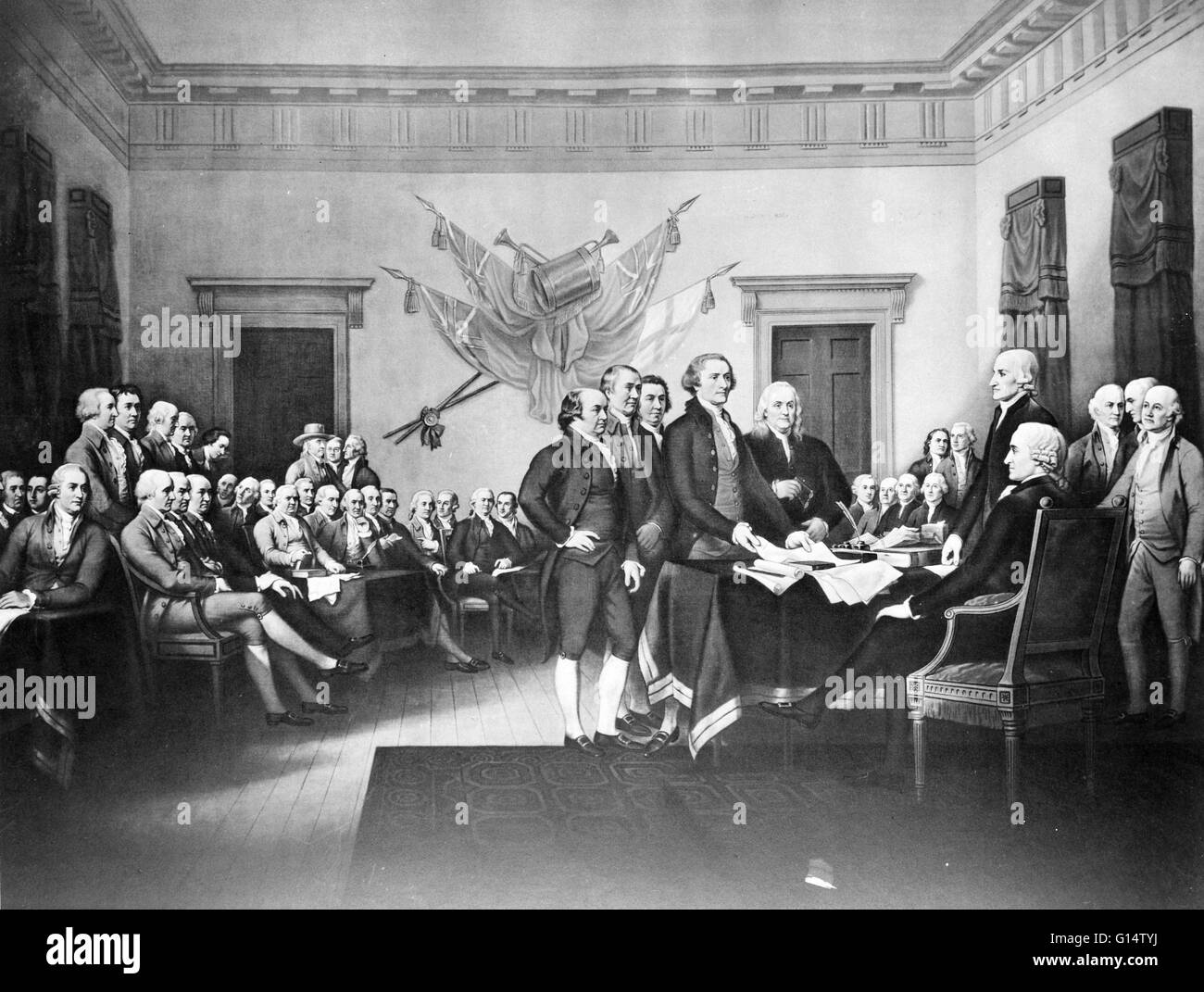 The signing of the Declaration of Independence on July 4, 1776 in Philadelphia. This original painting by John Trumbull hangs on display in the U.S. Capitol. Stock Photo