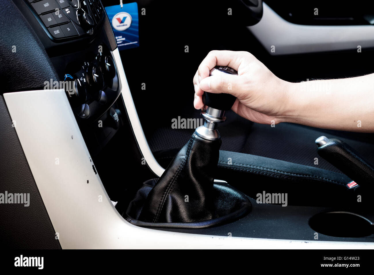 Hand changing a car transmission Stock Photo Alamy