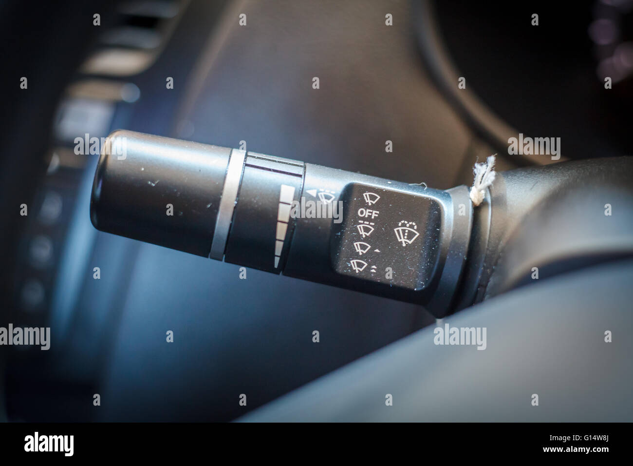 Wipers control buttons in car interior. Stock Photo