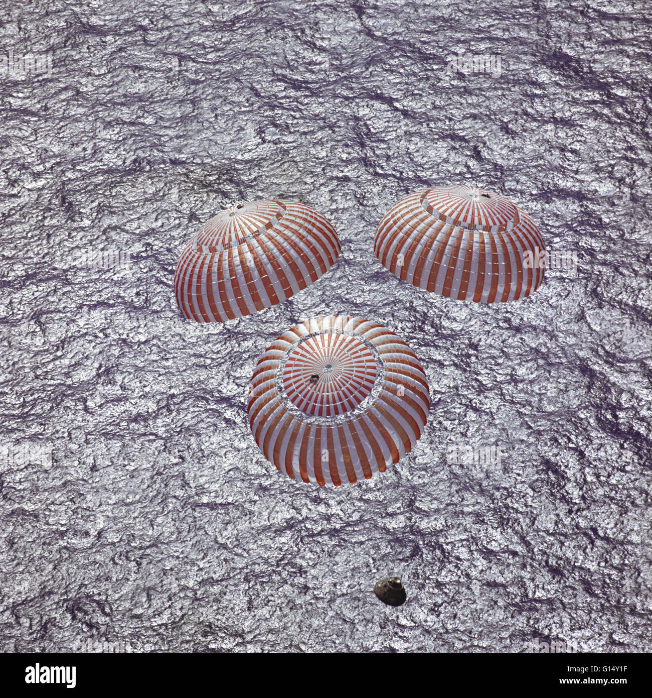 The Apollo 16 command module, with astronauts John W. Young, Thomas K. Mattingly II and Charles M. Duke Jr. aboard, nears splashdown in the central Pacific Ocean to successfully conclude a lunar landing mission. This overhead picture was taken from a reco Stock Photo