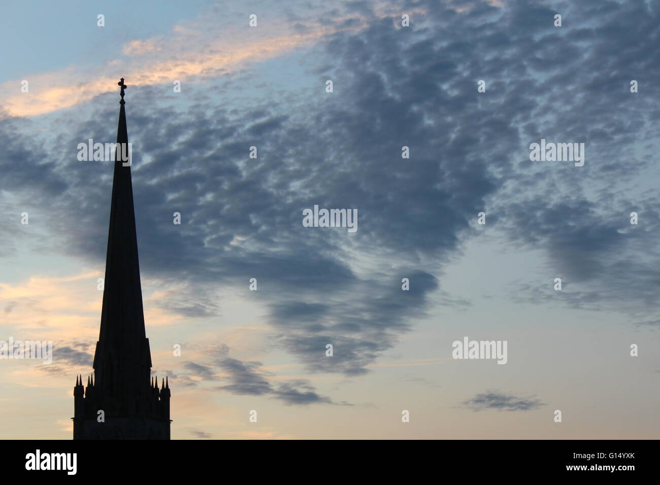 Church tower silhouette with a sunset background Stock Photo - Alamy