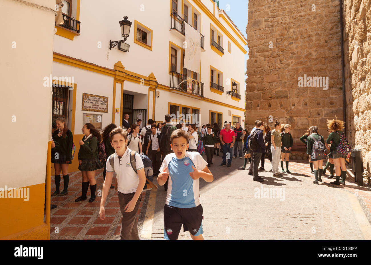 Spanish school boys leaving school, Marbella, Andalusia, Spain Europe Stock Photo