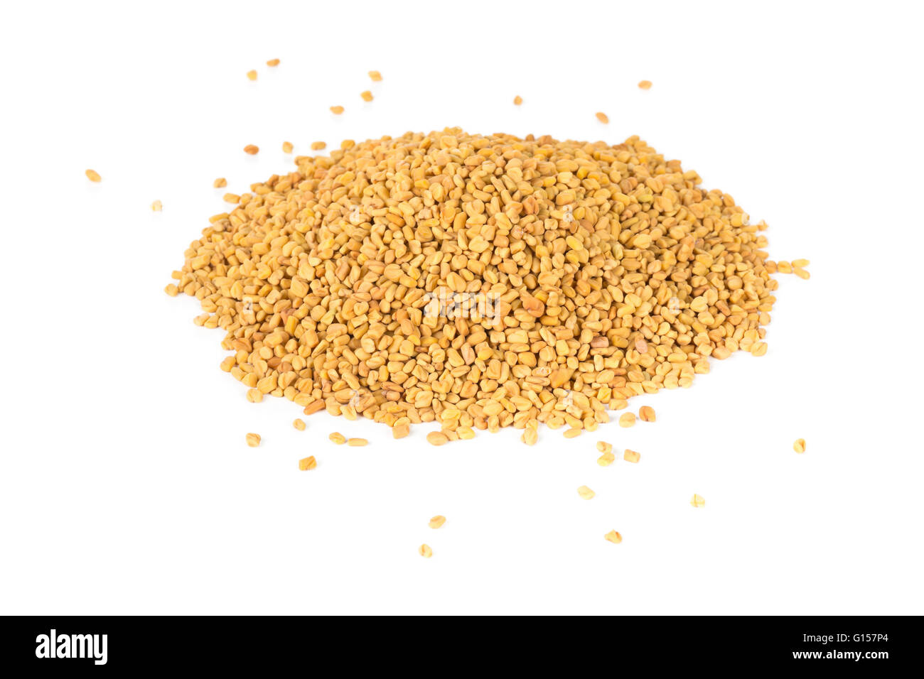 Unprocessed whole fenugreek (Trigonella foenum-graecumcumin) seeds heap over white background Stock Photo