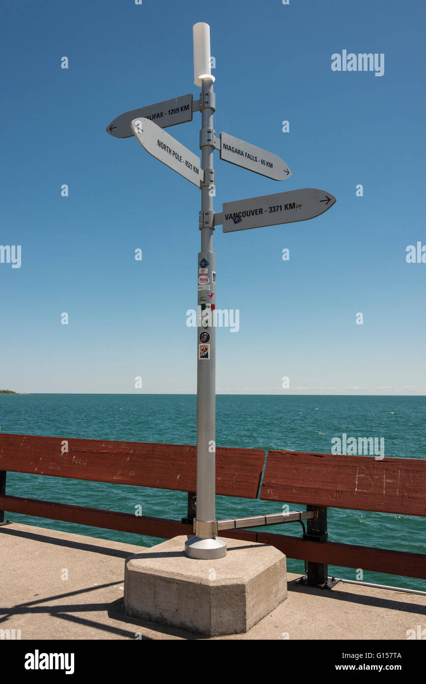 Direction sign at the end of the pier, Chelsea Beach, Toronto Island Park, Toronto, Ontario, Canada. Stock Photo