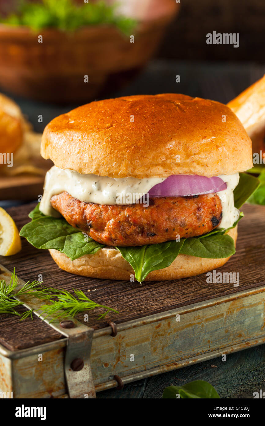 Homemade Salmon Burger with Tartar Sauce and Onion Stock Photo Alamy