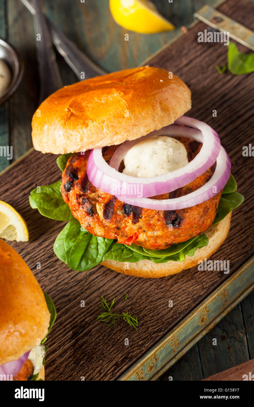 Homemade Salmon Burger with Tartar Sauce and Onion Stock Photo Alamy