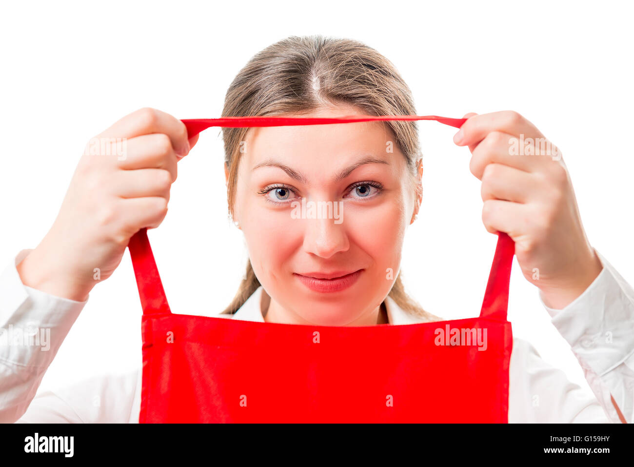 young brunette wears a red apron isolated Stock Photo