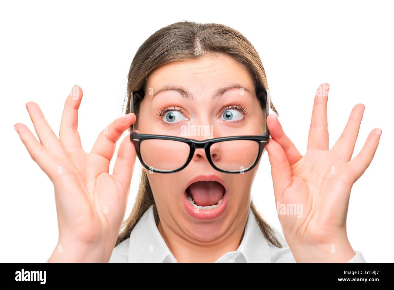 greatly shocked woman with glasses face close-up Stock Photo