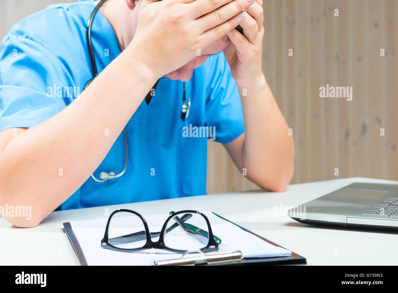 Tired doctor hi-res stock photography and images - Alamy
