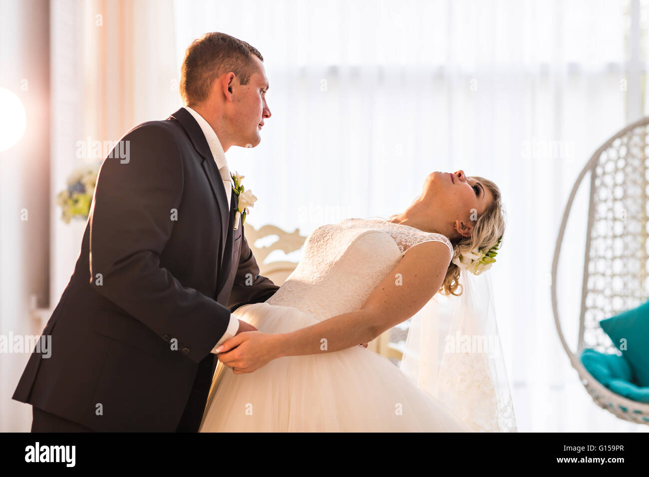 Young wedding couple enjoying romantic moments Stock Photo - Alamy
