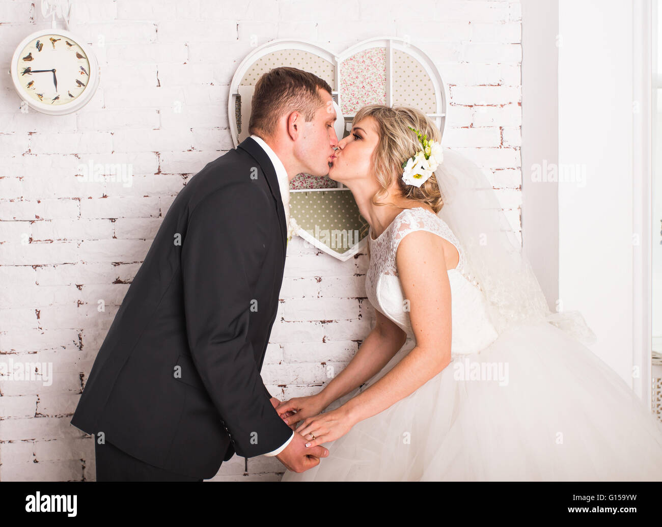 Young wedding couple enjoying romantic moments Stock Photo - Alamy