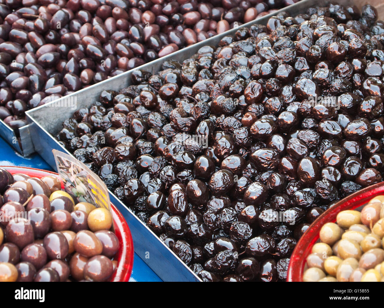 traditional Greek black olives at a street market,three varieties,Kalamata olives, Thasos olives