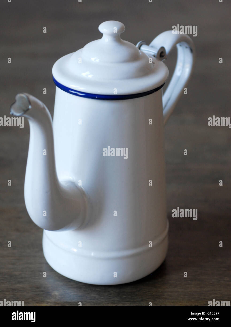 https://c8.alamy.com/comp/G15B97/enameled-teapot-pitcher-white-large-vintage-decoration-kitchen-enamel-G15B97.jpg