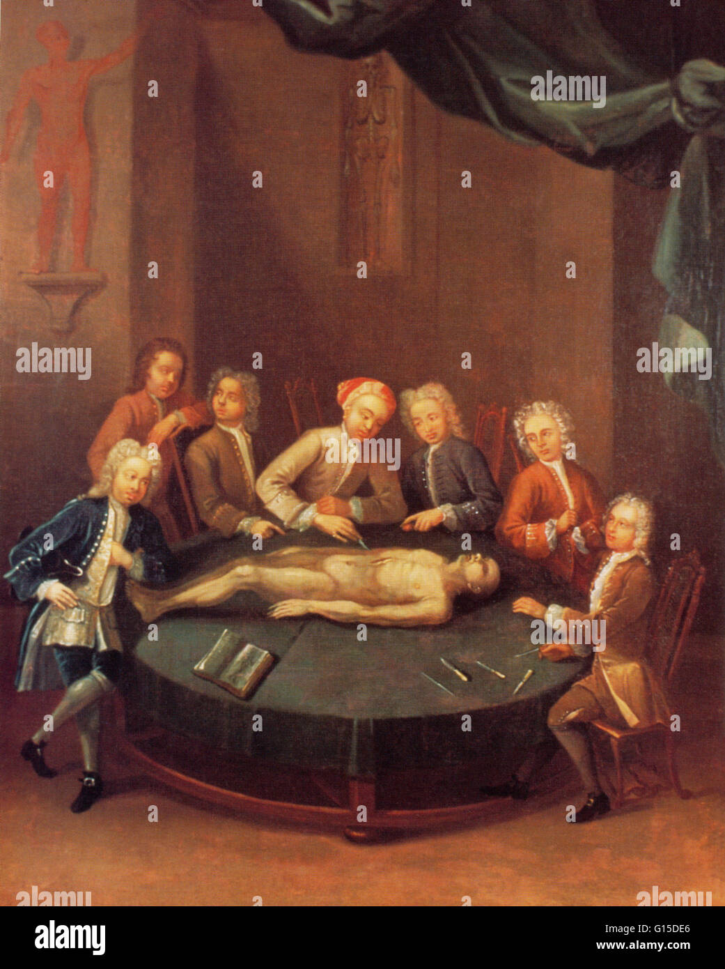 English surgeon and teacher of anatomy and surgery William Cheselden (1688 - 1752) performing a dissection at the Barber-Surgeons' Hall, circa 1730. An anonymous oil painting by an artist of limited skill. Cheselden is wearing his turban, which he preferr Stock Photo