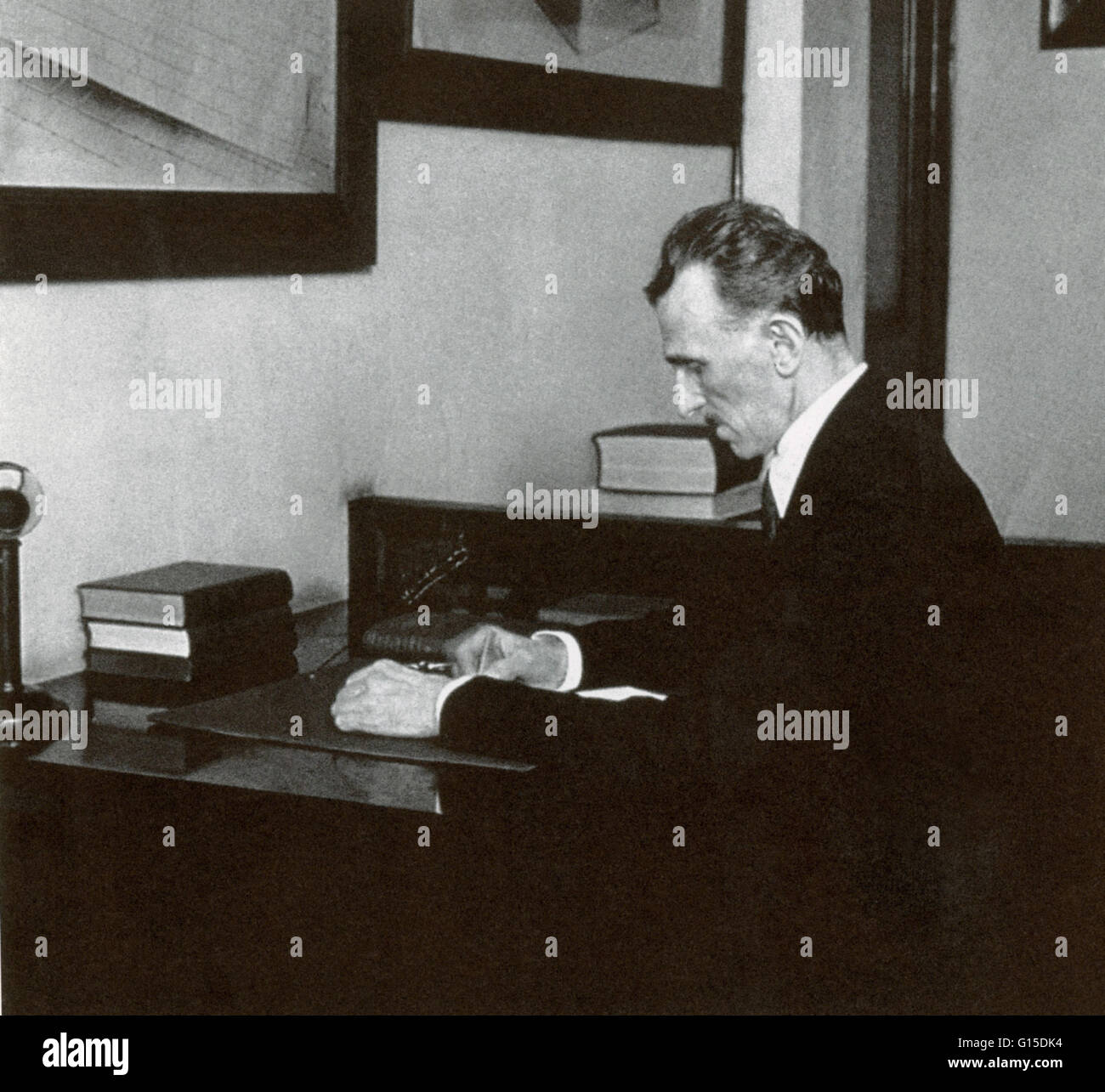 Tesla working in his office at 8 West 40th Street, New York City in 1916. Nikola Tesla (July 10, 1856 - January 7, 1943) was a Serbian-American inventor, mechanical engineer, electrical engineer, and futurist. He was an important contributor to the use of Stock Photo