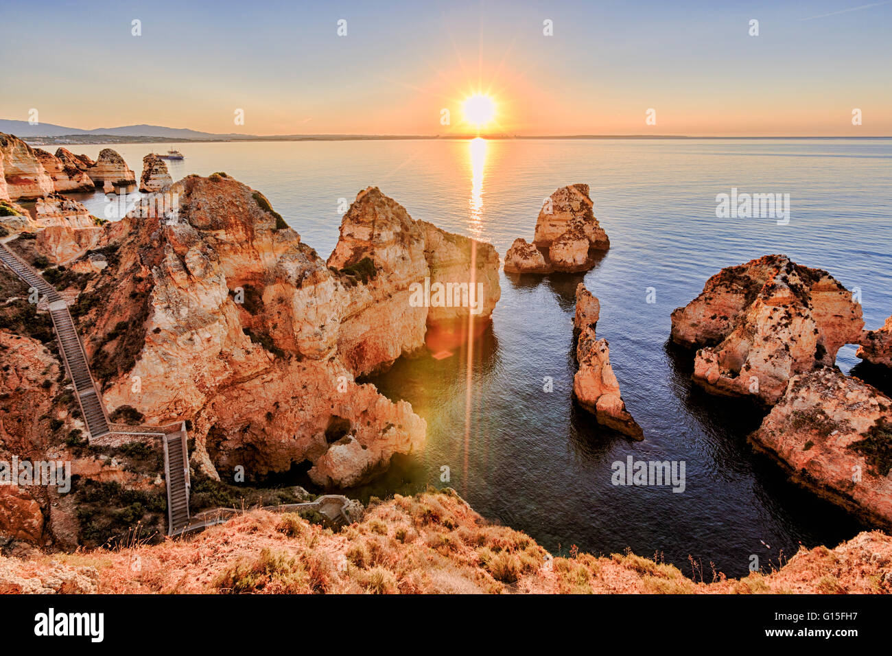 Golden sunrise on the red cliffs of Ponta Da Piedade, Lagos, Algarve, Portugal, Europe Stock Photo