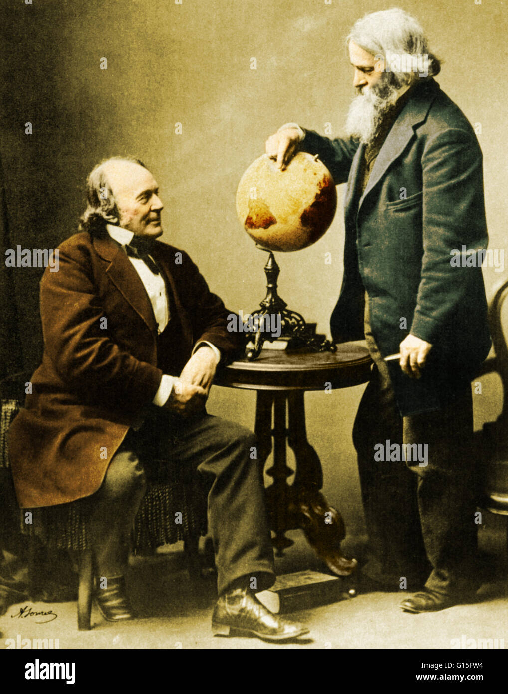 Louis Agassiz, zoologist and geologist, and Benjamin Peirce, mathematician and astronomer, conferring in 1871. Agassiz was an innovator in the study of the natural history of the Earth, while Peirce made contributions to the fields of algebra, the mathema Stock Photo