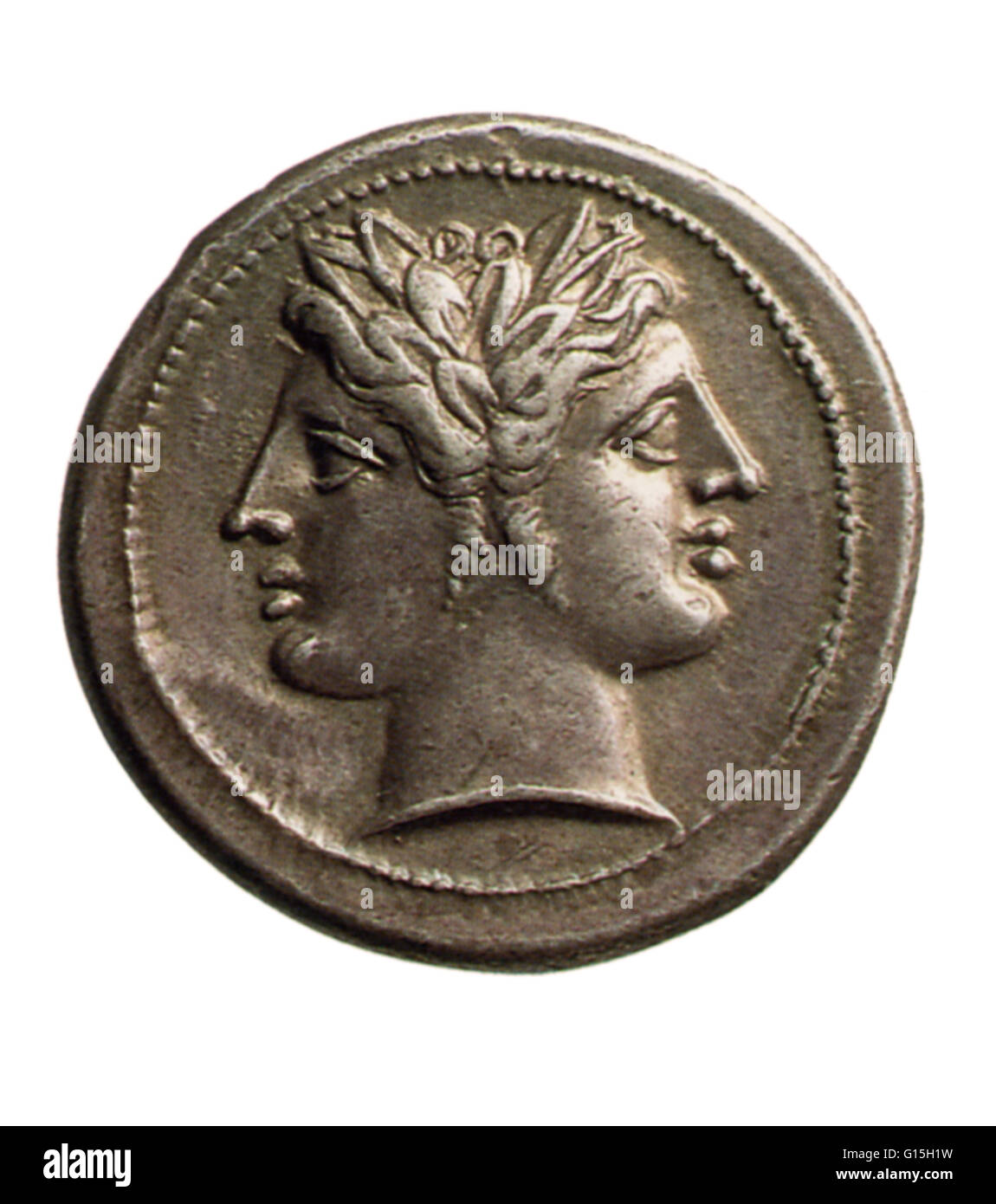 Roman coin featuring Janus, the god of beginnings and transitions. He is depicted as having two heads, symbolically looking into both the future and the past. The month of January is named after him. Stock Photo