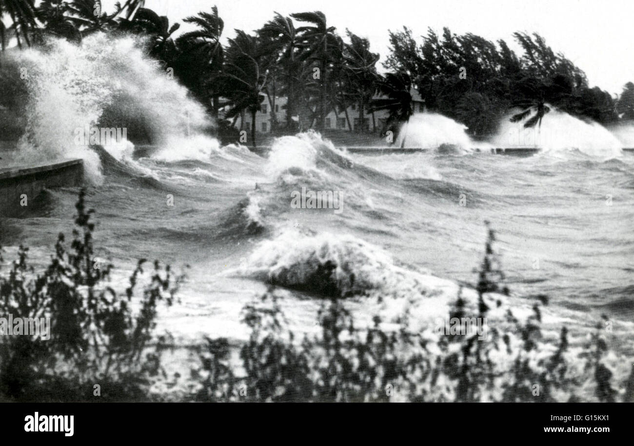 Hurricane waves striking sea wall. No location or date given. A hurricane is a severe, rotating tropical storm with heavy rains and cyclonic winds exceeding 74 miles (119 km) per hour, especially when occurring in the Northern Hemisphere. Hurricanes origi Stock Photo