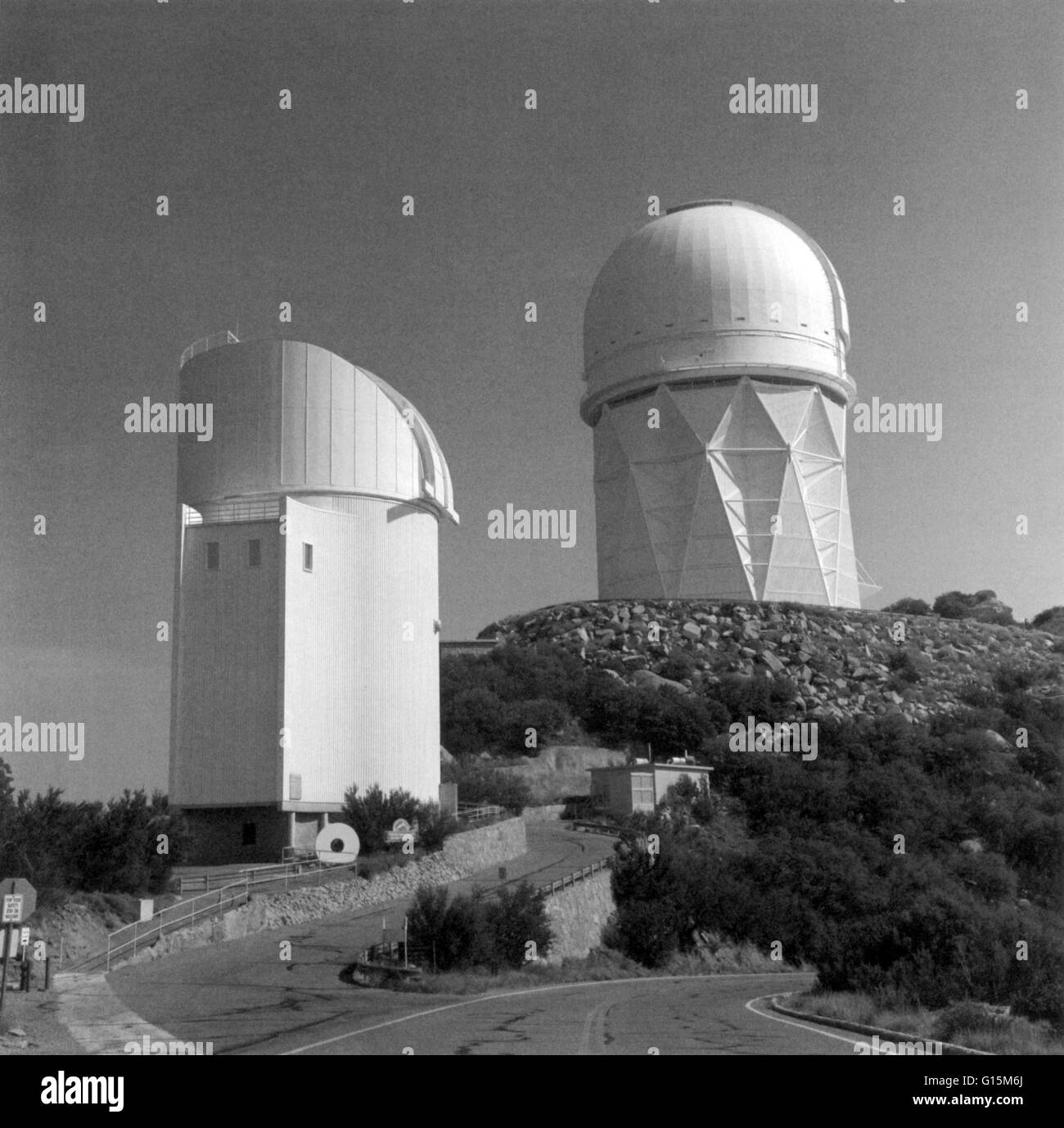 The Kitt Peak National Observatory (KPNO) in 1960. Kitt Peak is part of the Quinlan Mountains in the Arizona-Sonoran Desert southwest of Tucson. Shown here are the Mayall 4-m telescope (right) and the Bok 2.3-m (90 in) telescope (left). Stock Photo