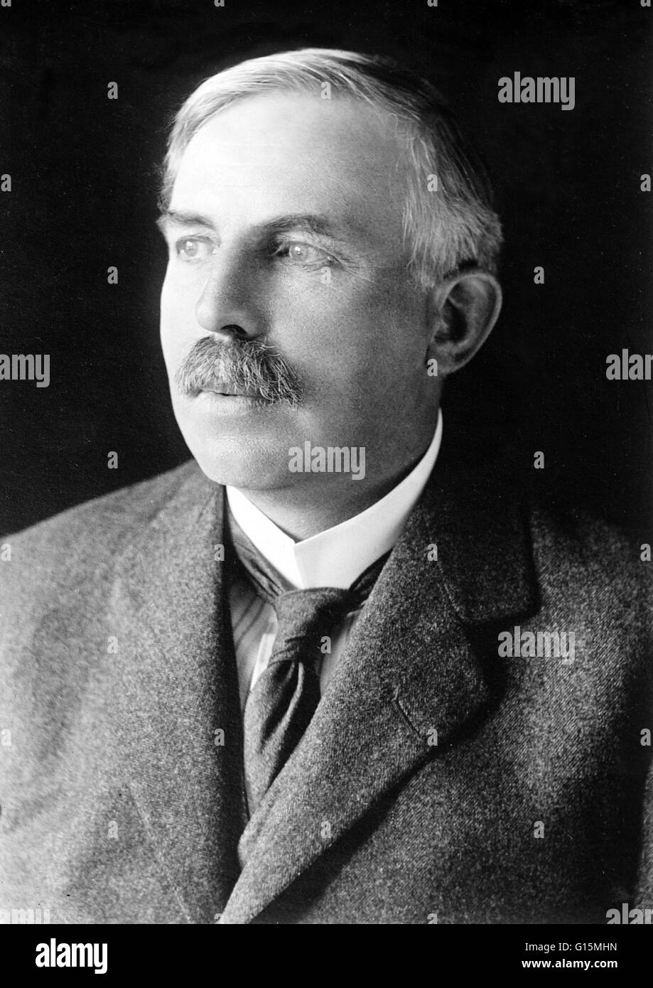 Ernest Rutherford (August 30, 1871 - October 19, 1937) was a New Zealand-born British chemist and physicist who became known as the father of nuclear physics. He discovered the concept of radioactive half-life, proved that radioactivity involved the trans Stock Photo