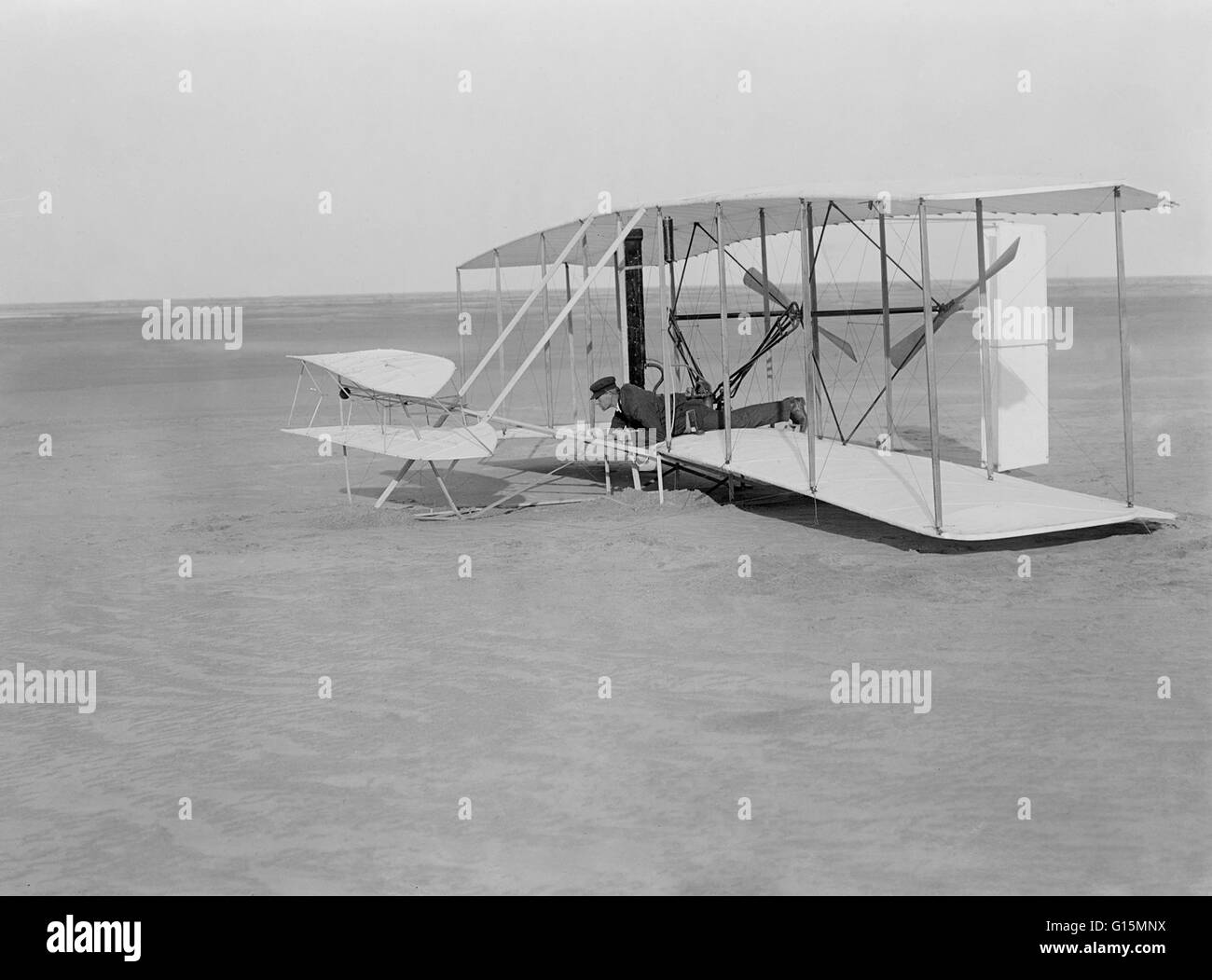 Wright Flyer. Wilbur Wright crash landing the Wright Flyer on December 14 1903. This trial flight actually left the ground and only slightly damaged the aircraft. Following repairs the first powered flight took place on 17th December, covering 36.6 meters Stock Photo